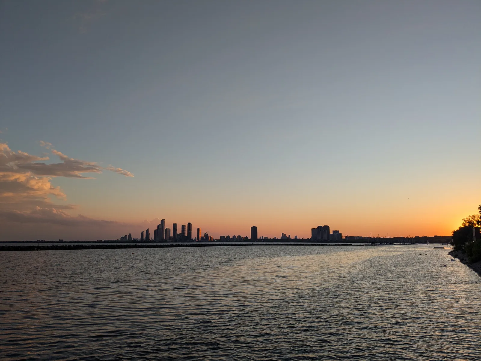 Lake Ontario and the Humber Bay skyline at sunset, photographed from Marilyn Bell Park